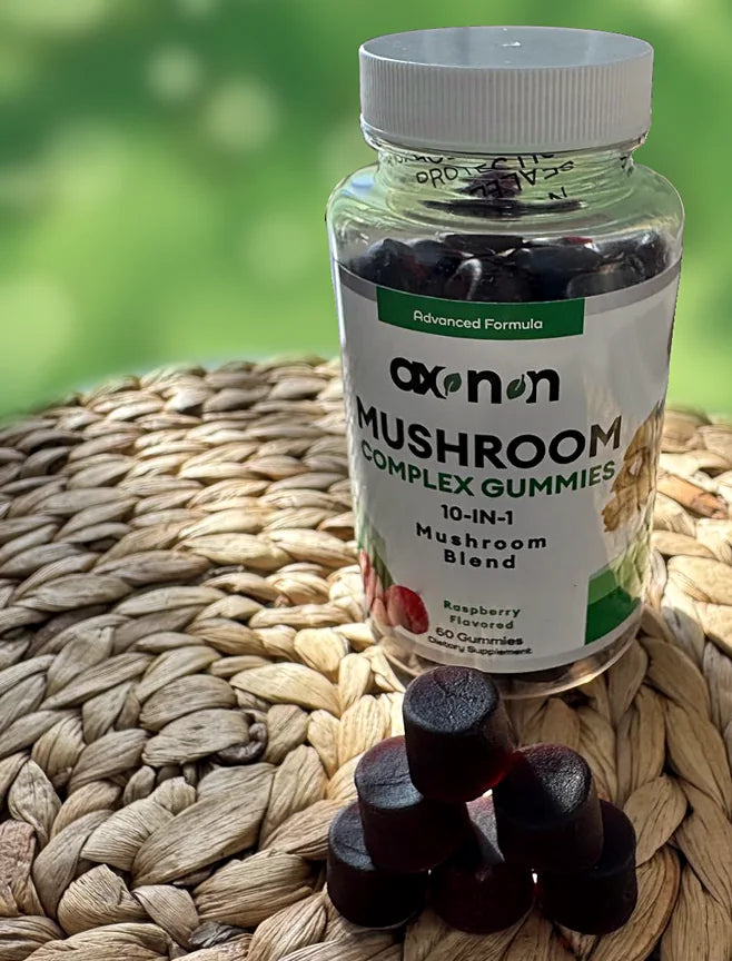 AXONON Mushroom Complex Gummies bottle with gummies on a table